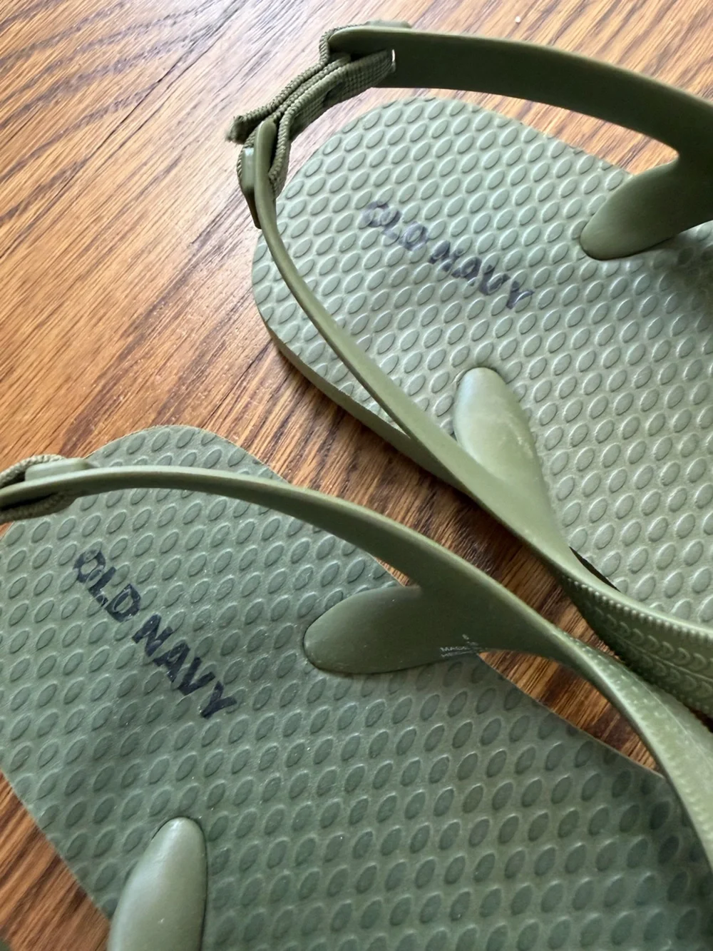 Old Navy olive green flip flops, toddler size 8